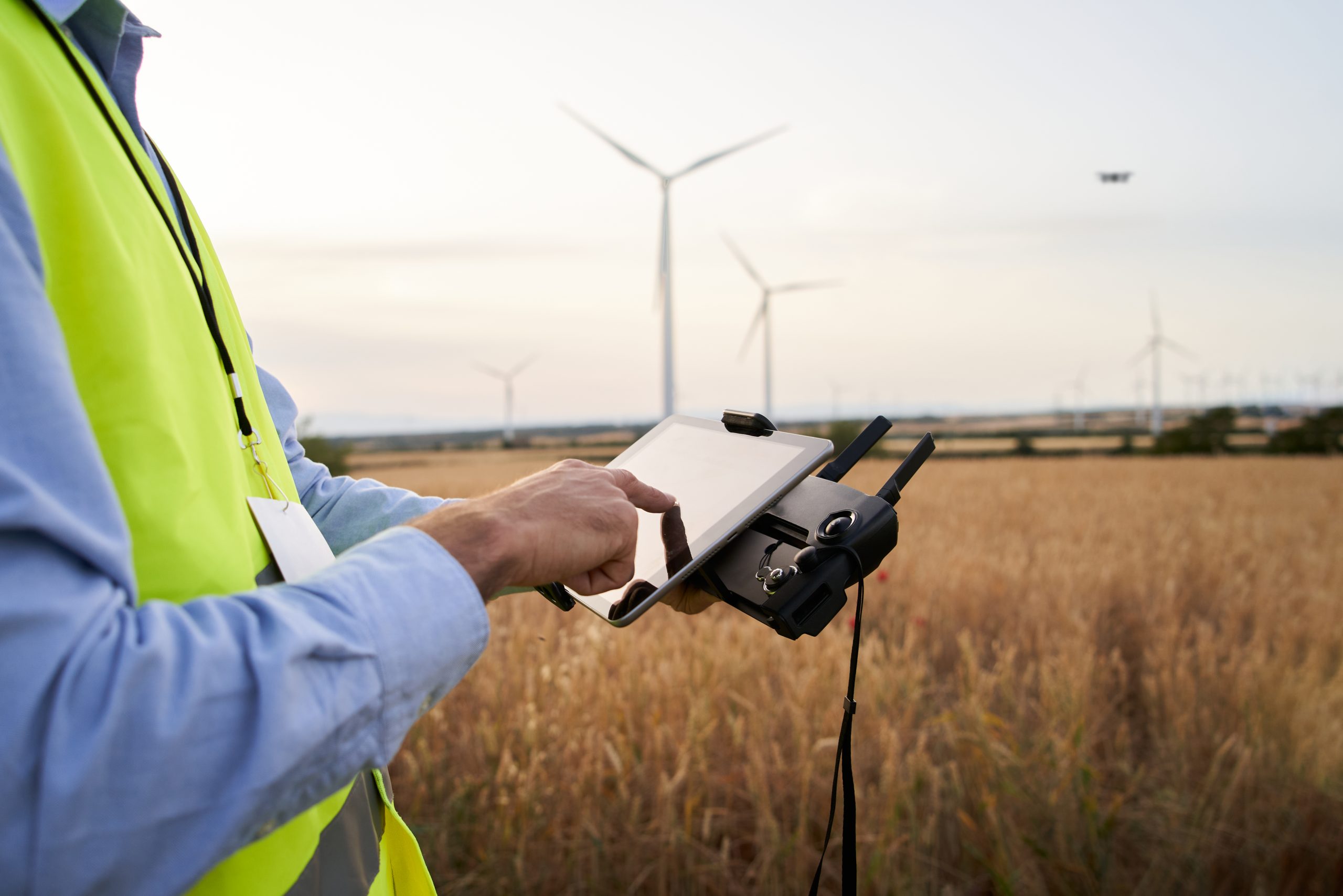 Operator holding remote control operating drone using remote controller Engineer playing with drone